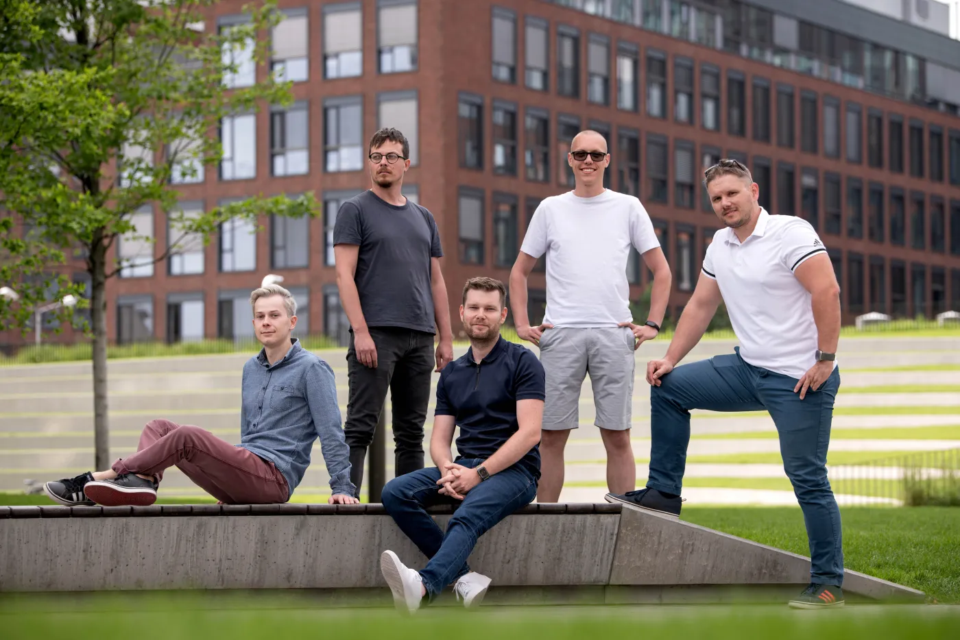 The Rucolabs team outdoors in front of an office building in Bratislava